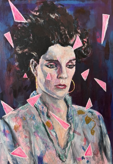 non-binary person wearing blue blouse and surrounded by flying pink triangles yes really